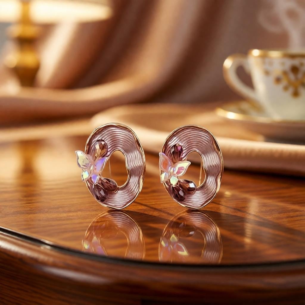 dazzle21 beige iridescent butterfly oval stud earrings with gold-tone textured frames and delicate bead accents