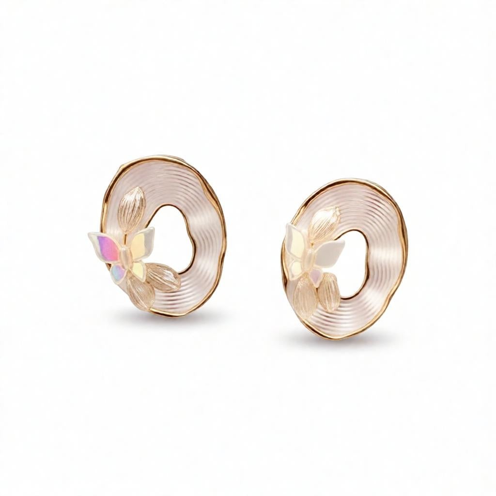 dazzle21 beige iridescent butterfly stud earrings with gold-tone textured oval frames and opalescent floral accents.