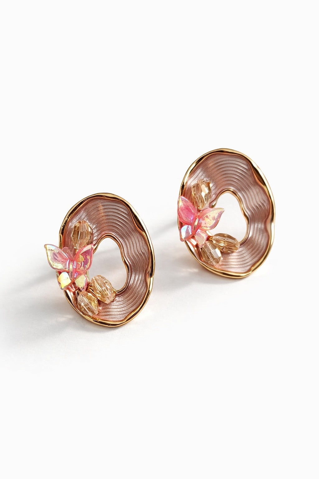 dazzle21 beige iridescent butterfly stud earrings with gold-tone oval frames and delicate peach bead accents