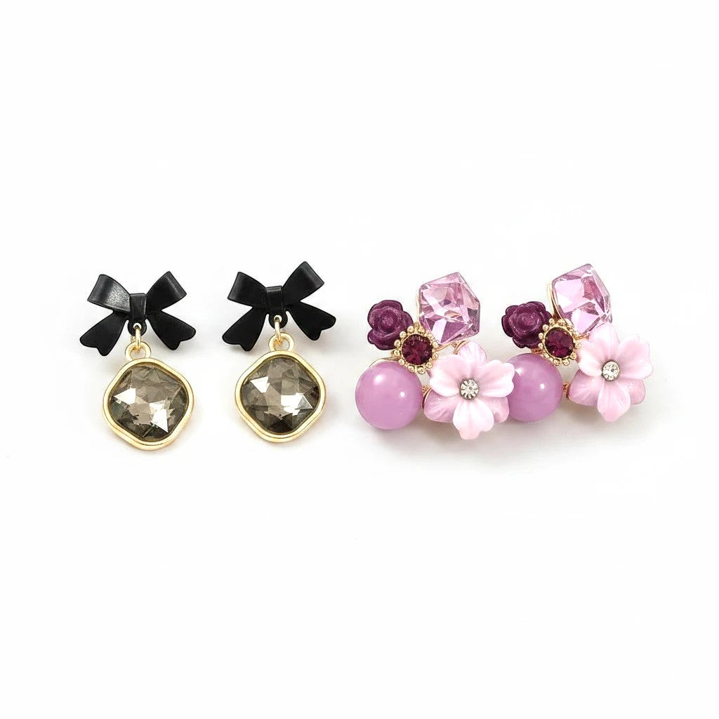 dazzle21 set of two earrings featuring black bow studs with grey crystals and purple floral rhinestone cluster studs