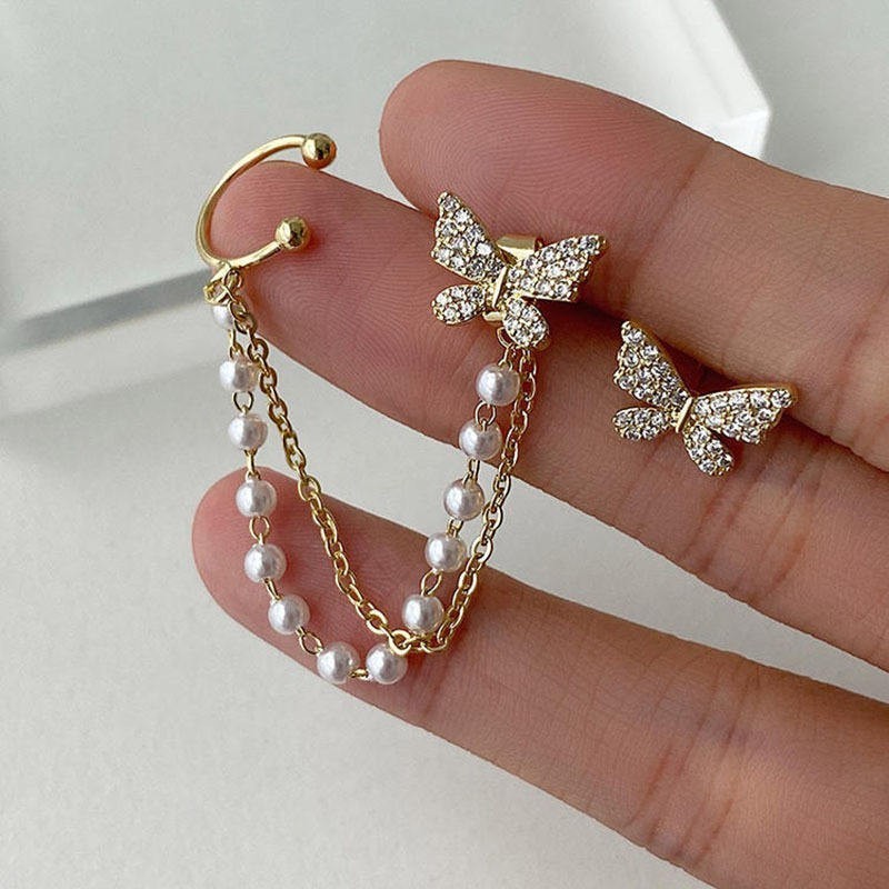 dazzle21 golden butterfly stud earrings with a detachable double chain ear cuff featuring white enamel beads and crystals