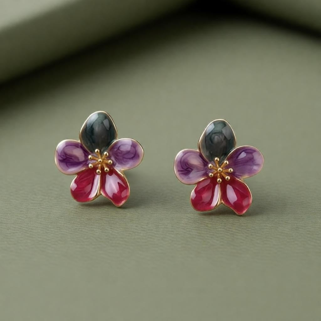 dazzle21 handcrafted floral stud earrings with green, purple, and ruby enamel petals and delicate gold centers.