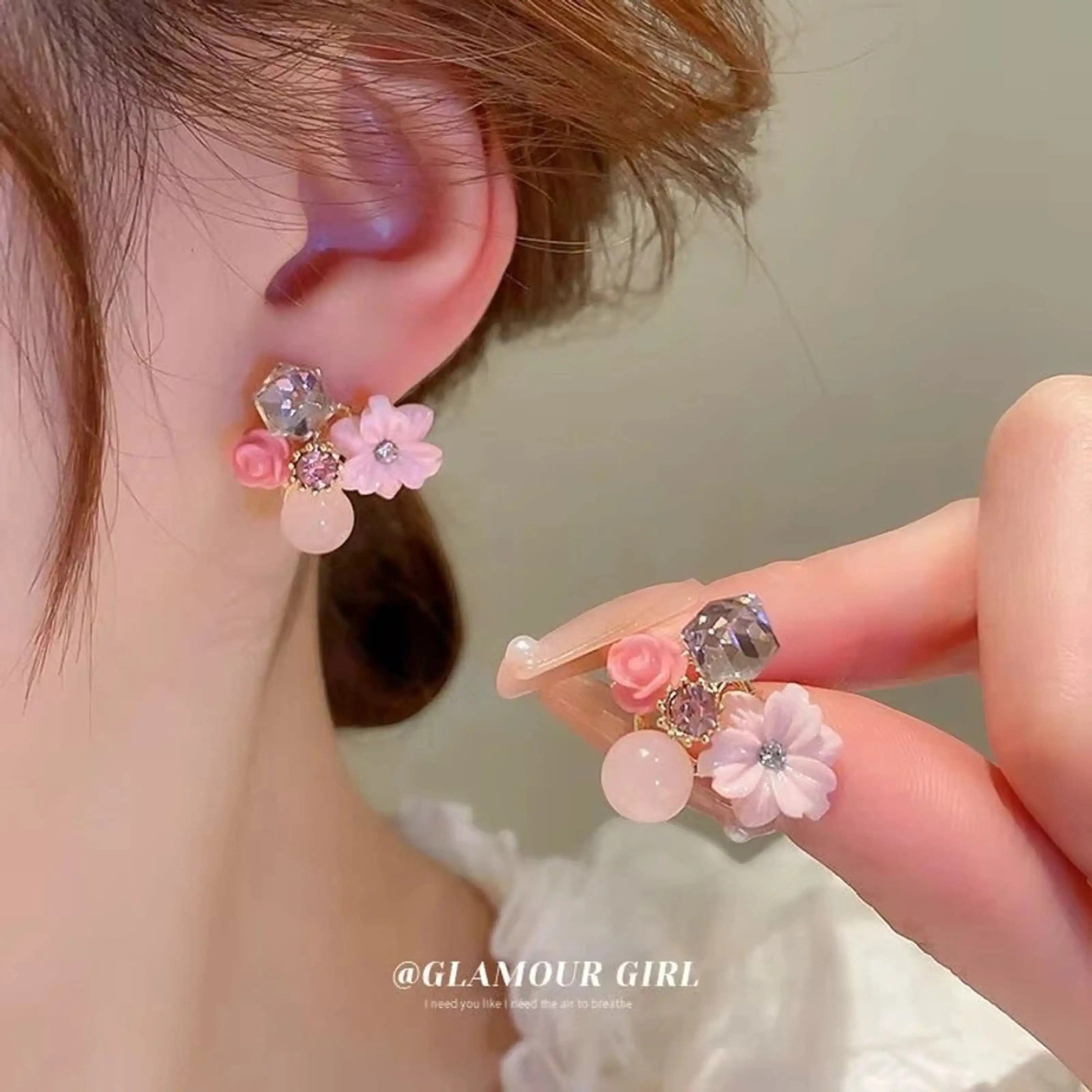 dazzle21 Korean designer stud earrings featuring pink floral accents, clear crystals, and soft blush stone beads