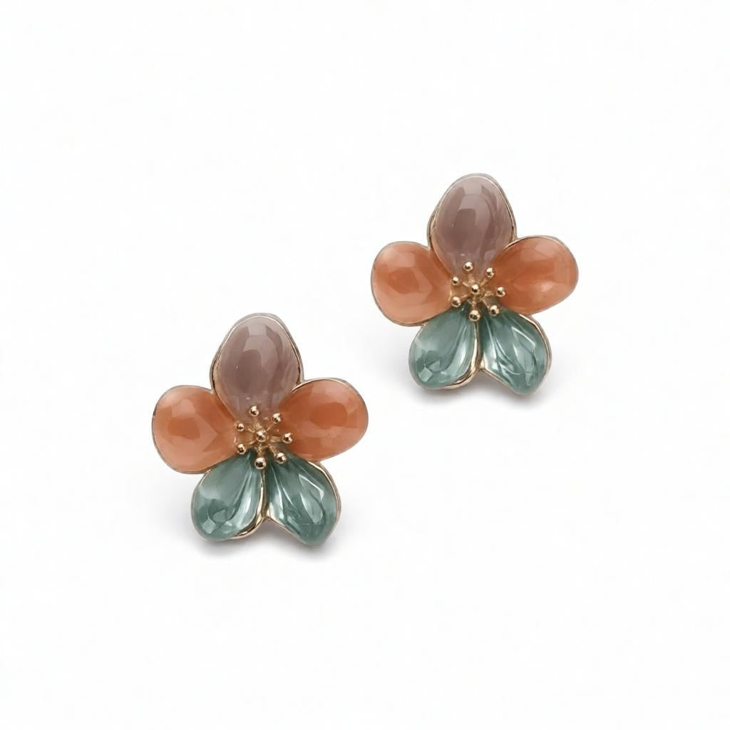 dazzle21 handcrafted floral stud earrings with green, purple, and ruby enamel petals and delicate gold center details.
