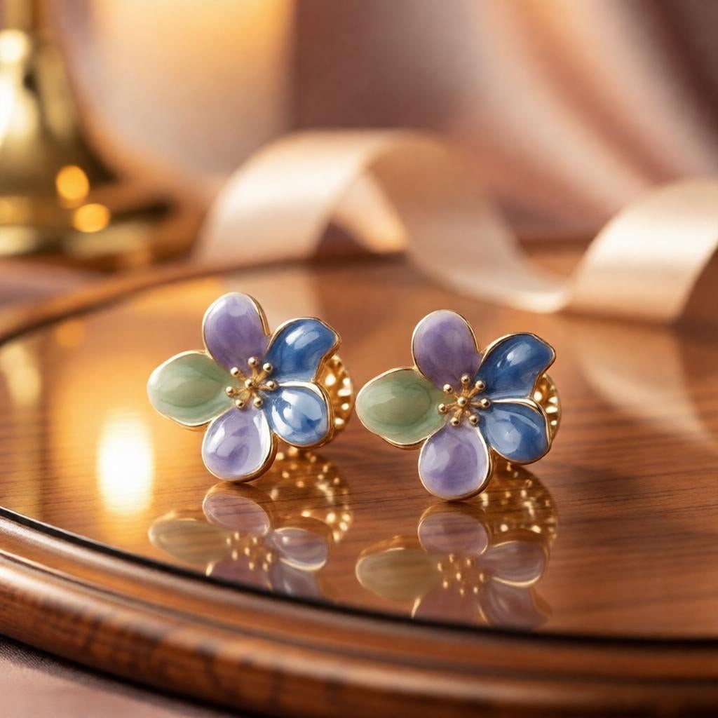 dazzle21 handcrafted floral stud earrings with green, purple, and blue enamel petals and delicate gold centers.