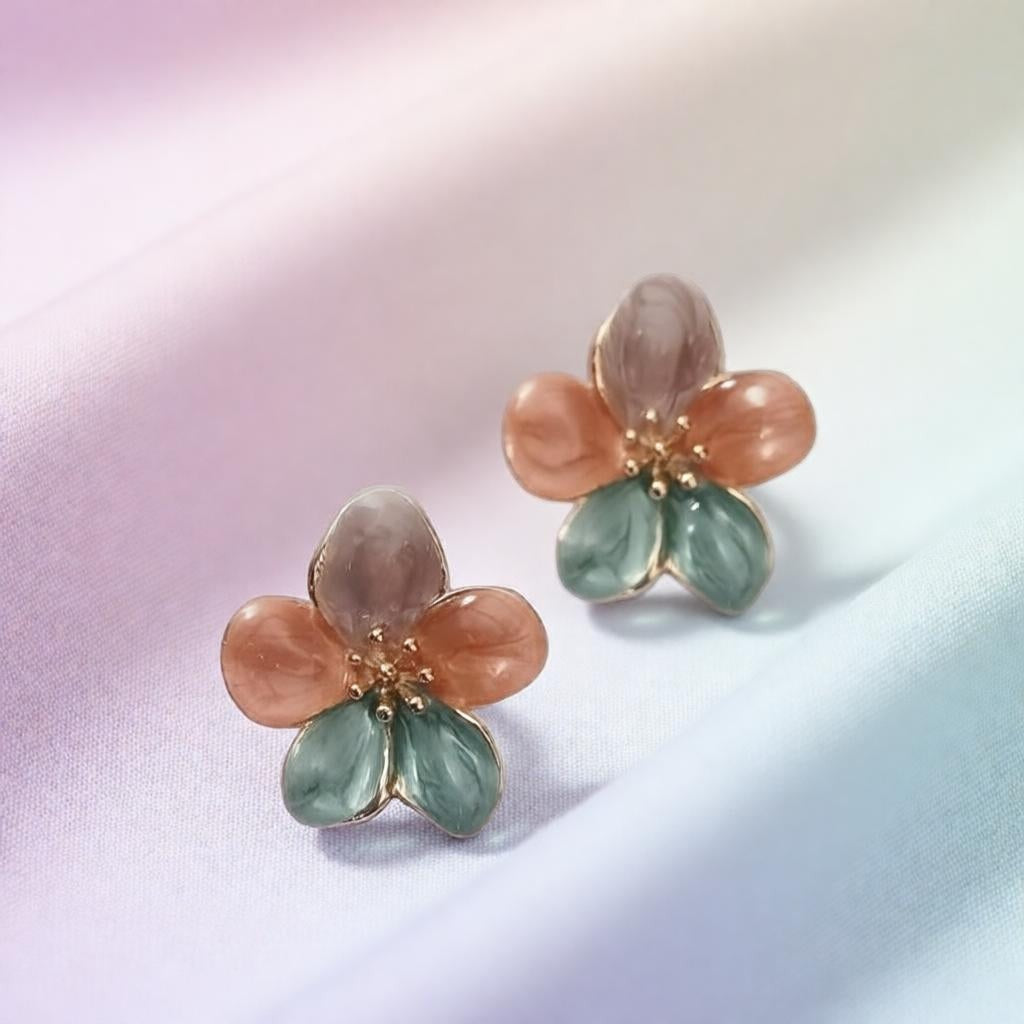 dazzle21 handcrafted floral stud earrings with green, purple, and ruby enamel petals and delicate gold centers.
