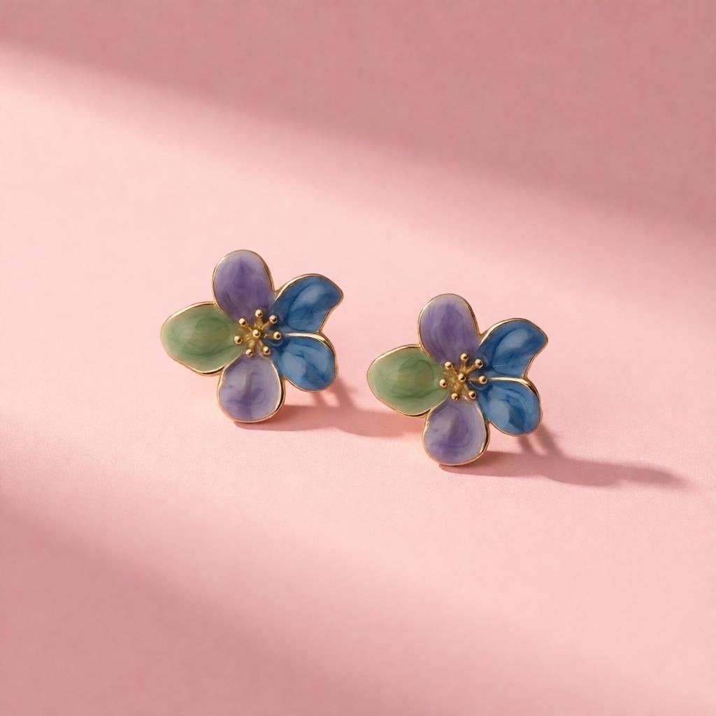 dazzle21 handcrafted floral stud earrings with purple, green, and blue enamel petals and delicate gold centers.