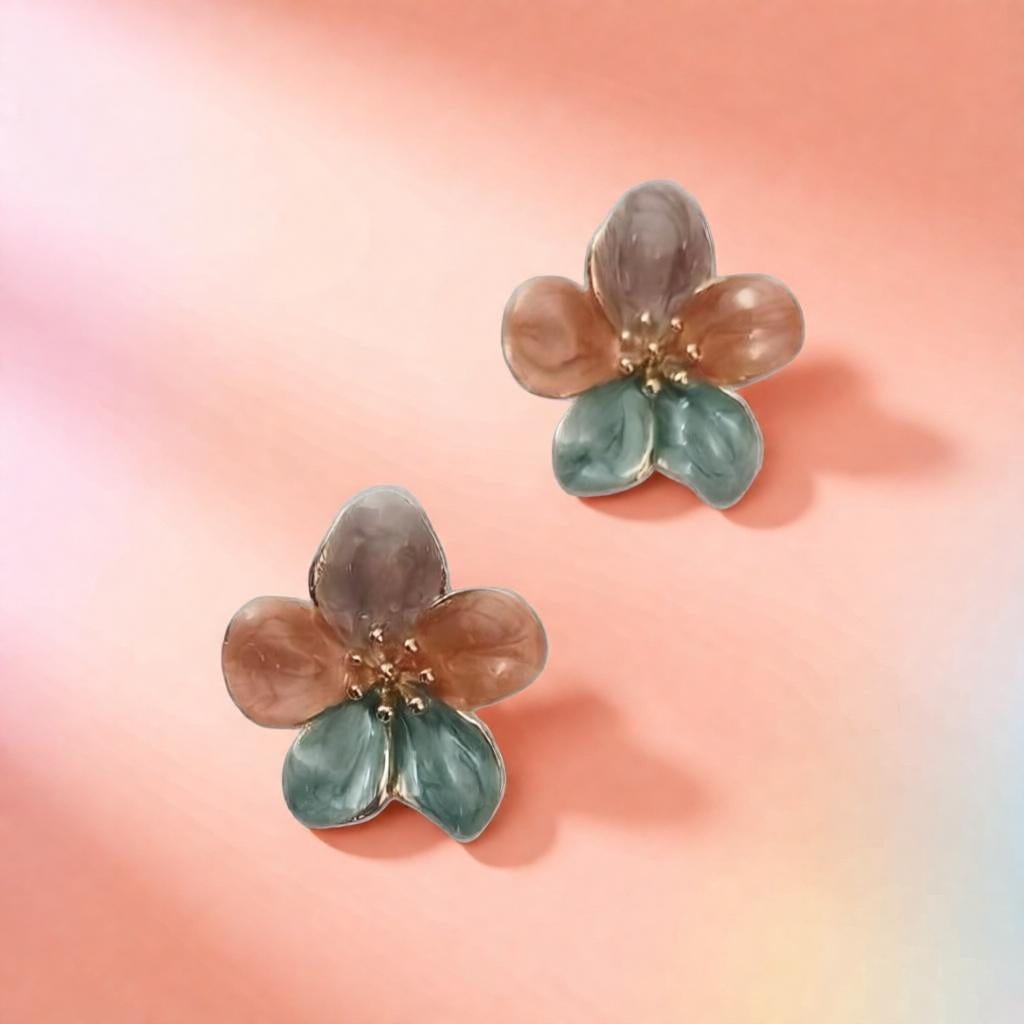 dazzle21 handcrafted floral stud earrings featuring green, purple, and ruby enamel petals with gold center detailing.