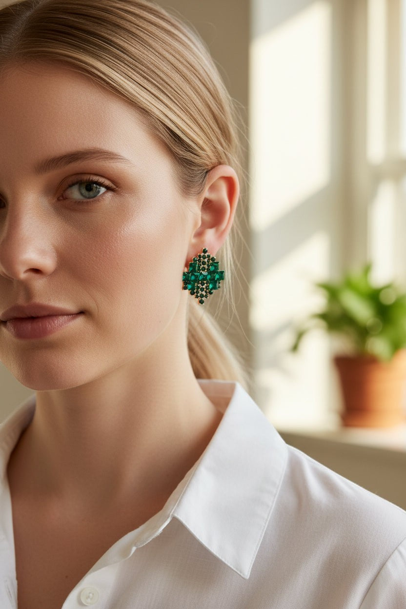 dazzle21 geometric stud earrings featuring sparkling green crystals in a rose gold setting worn by a woman