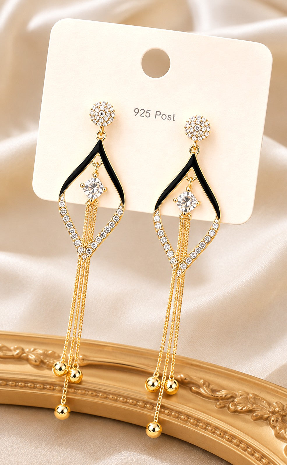 dazzle21 gold-plated drop earrings with black enamel, zircon crystal studs, and cascading tassel chains