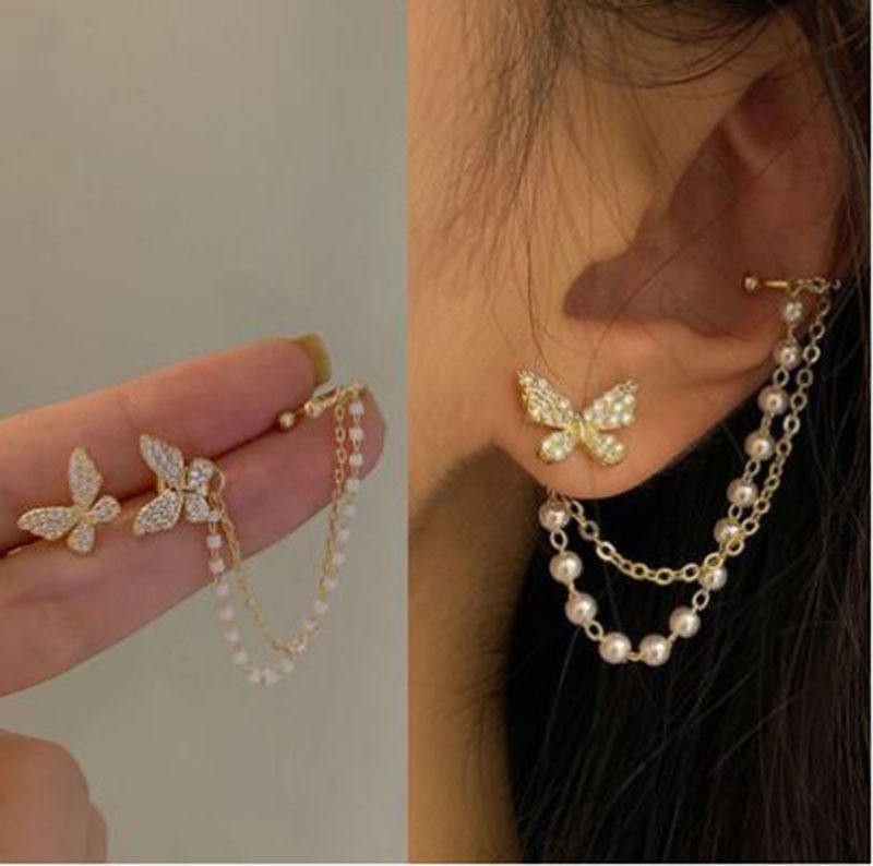 dazzle21 gold butterfly ear cuff earrings with crystal stones and dual chains featuring small white enamel beads