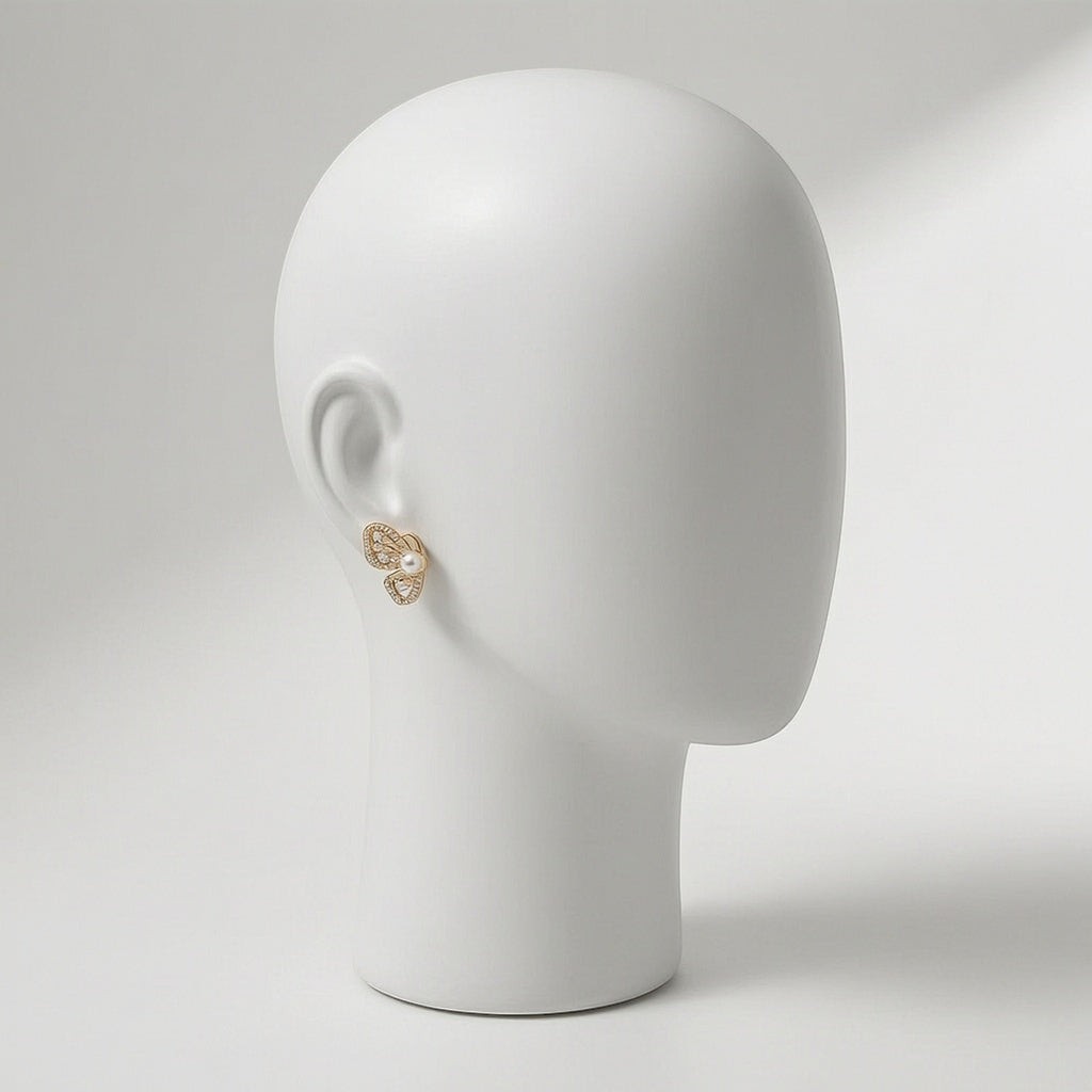 dazzle21 gold butterfly stud earring with a central pearl on a white mannequin head