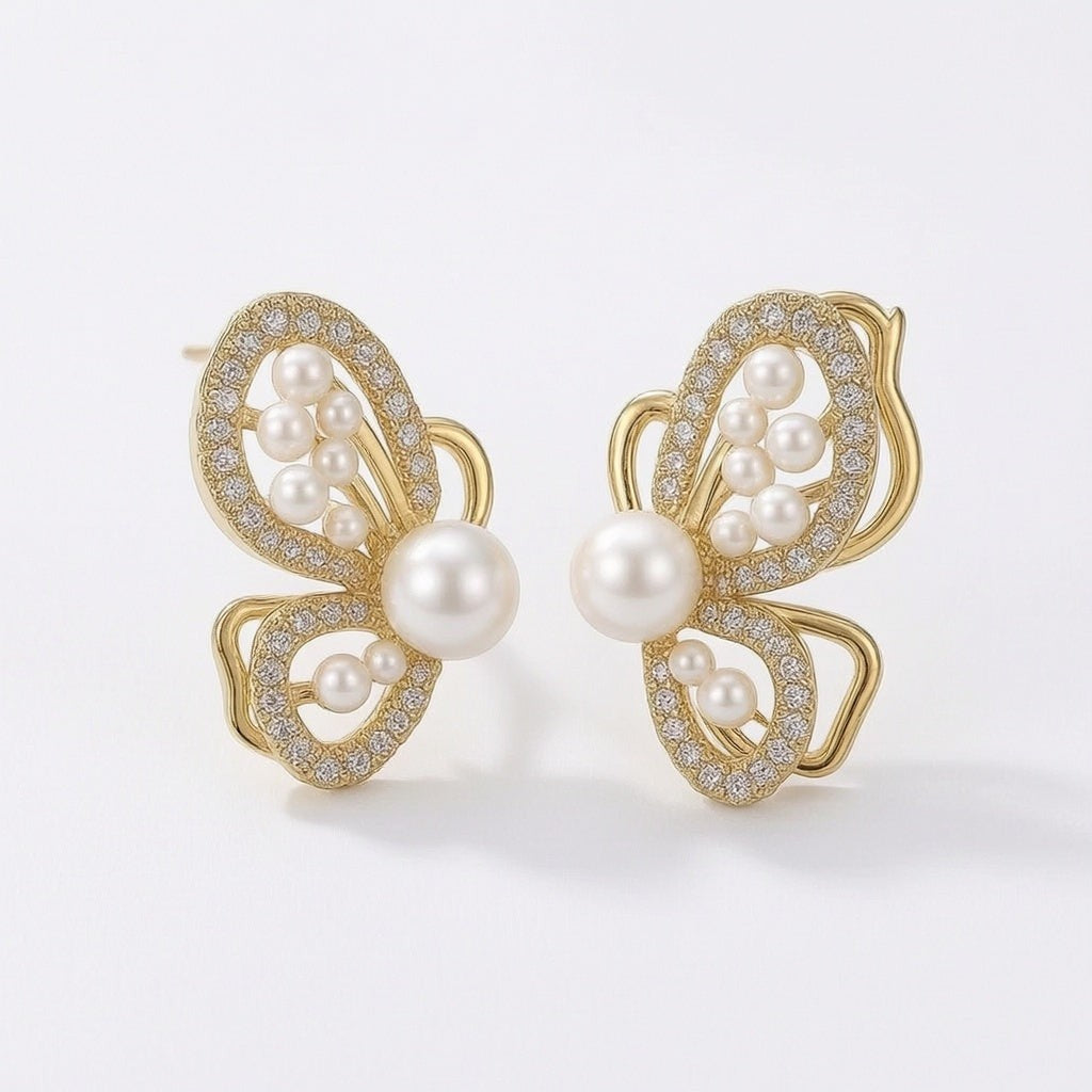 dazzle21 gold butterfly earrings featuring white pearls and sparkling crystal accents in a delicate Korean style