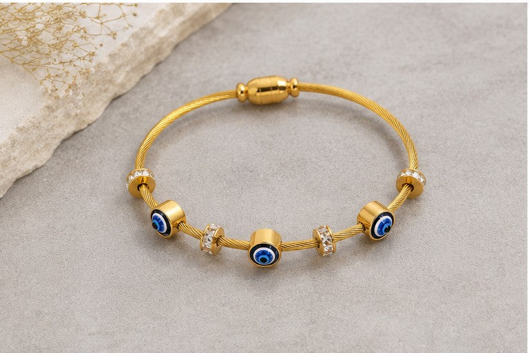 dazzle21 gold-tone cable wire bracelet featuring evil eye nazar charms and sparkling crystal accents