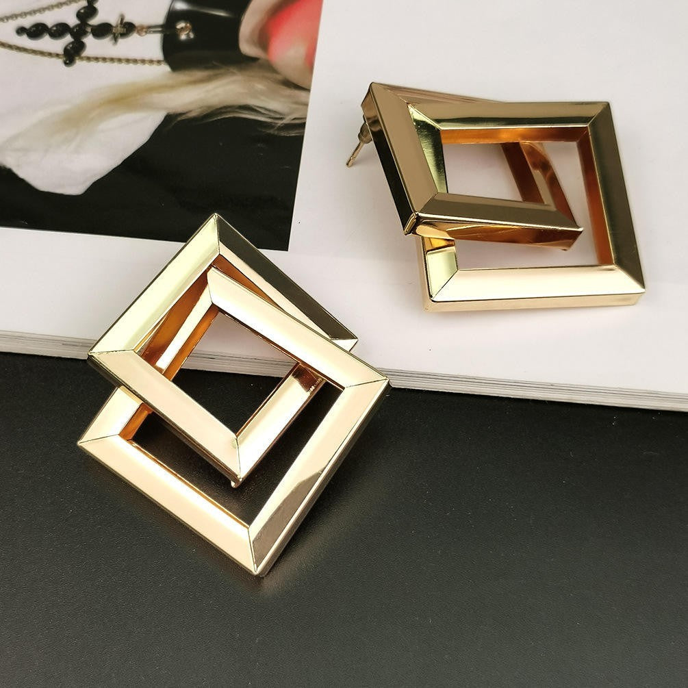 dazzle21 geometric square statement earrings in a polished gold-tone finish with a layered open frame design.