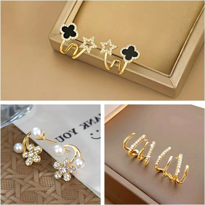 dazzle21 set of three Korean-style gold-tone earrings featuring black clover, star, pearl, and crystal stud designs.