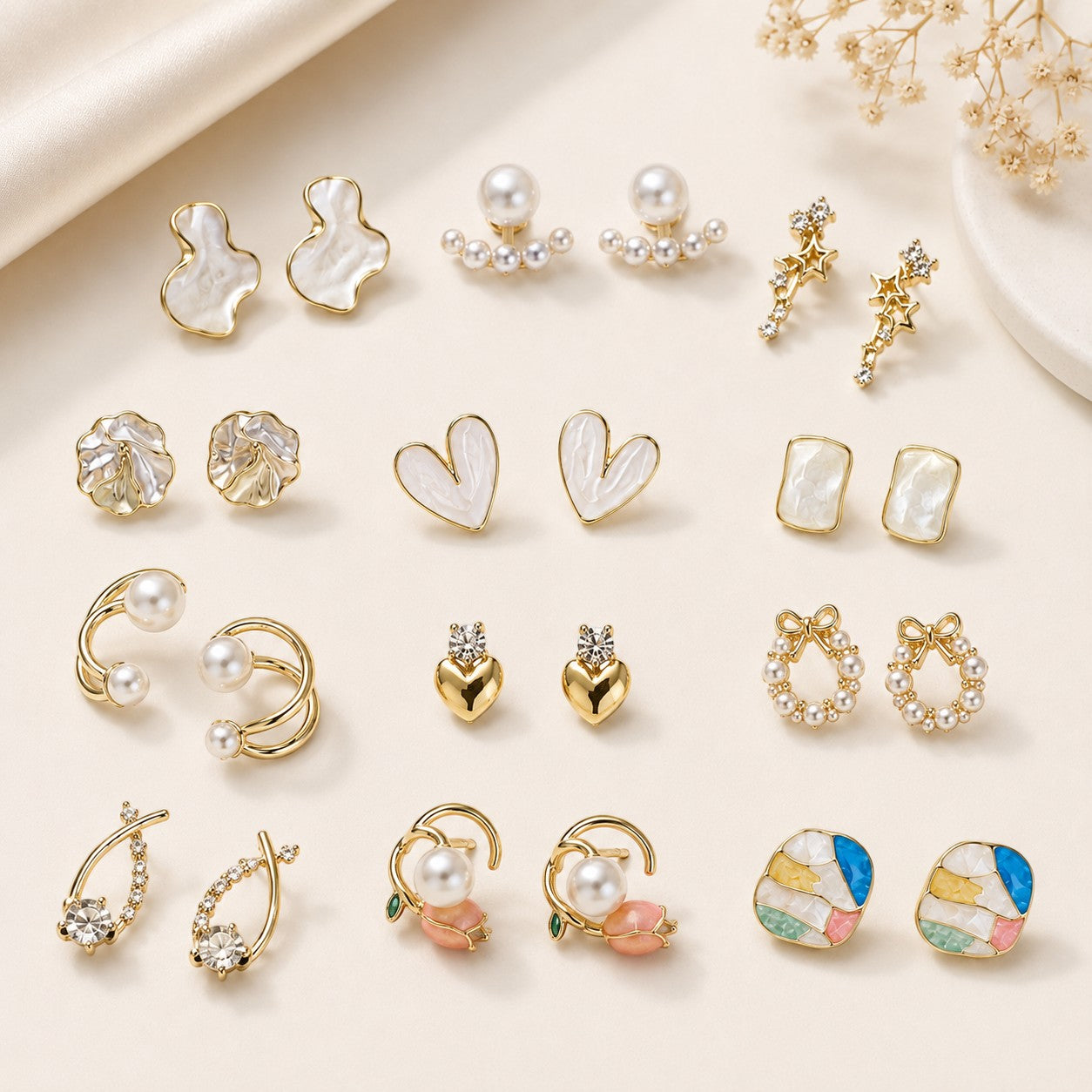 dazzle21 12-pair fashion earring set featuring gold-tone studs, hoops, and pearl accents in a gift box