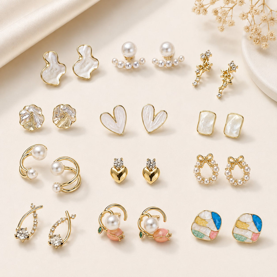 dazzle21 12-pair fashion earring set featuring gold-tone studs, hoops, and pearl accents in a gift box