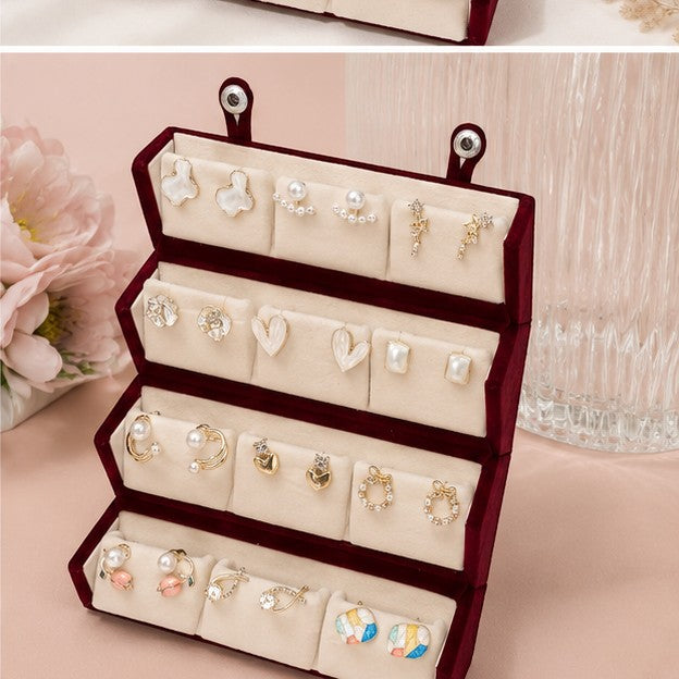 dazzle21 12-pair earring set featuring gold-tone studs, hoops, and pearl accents in a velvet display box