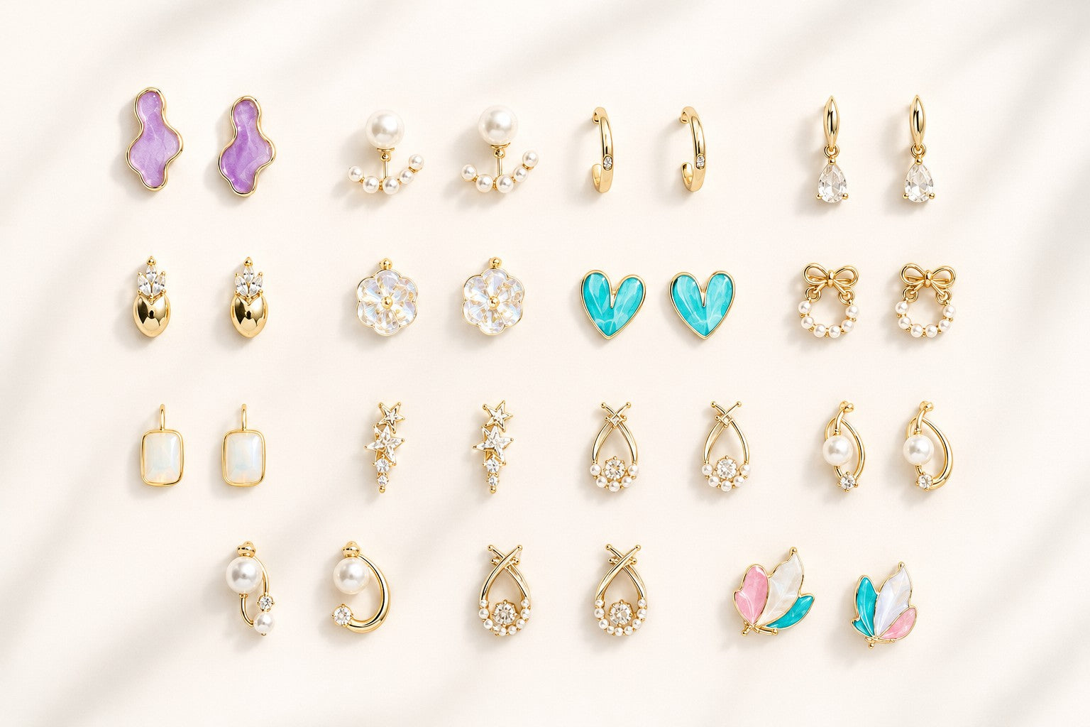 dazzle21 12-pair fashion earring set featuring gold-tone studs, hoops, and drop earrings with pearls and colorful accents