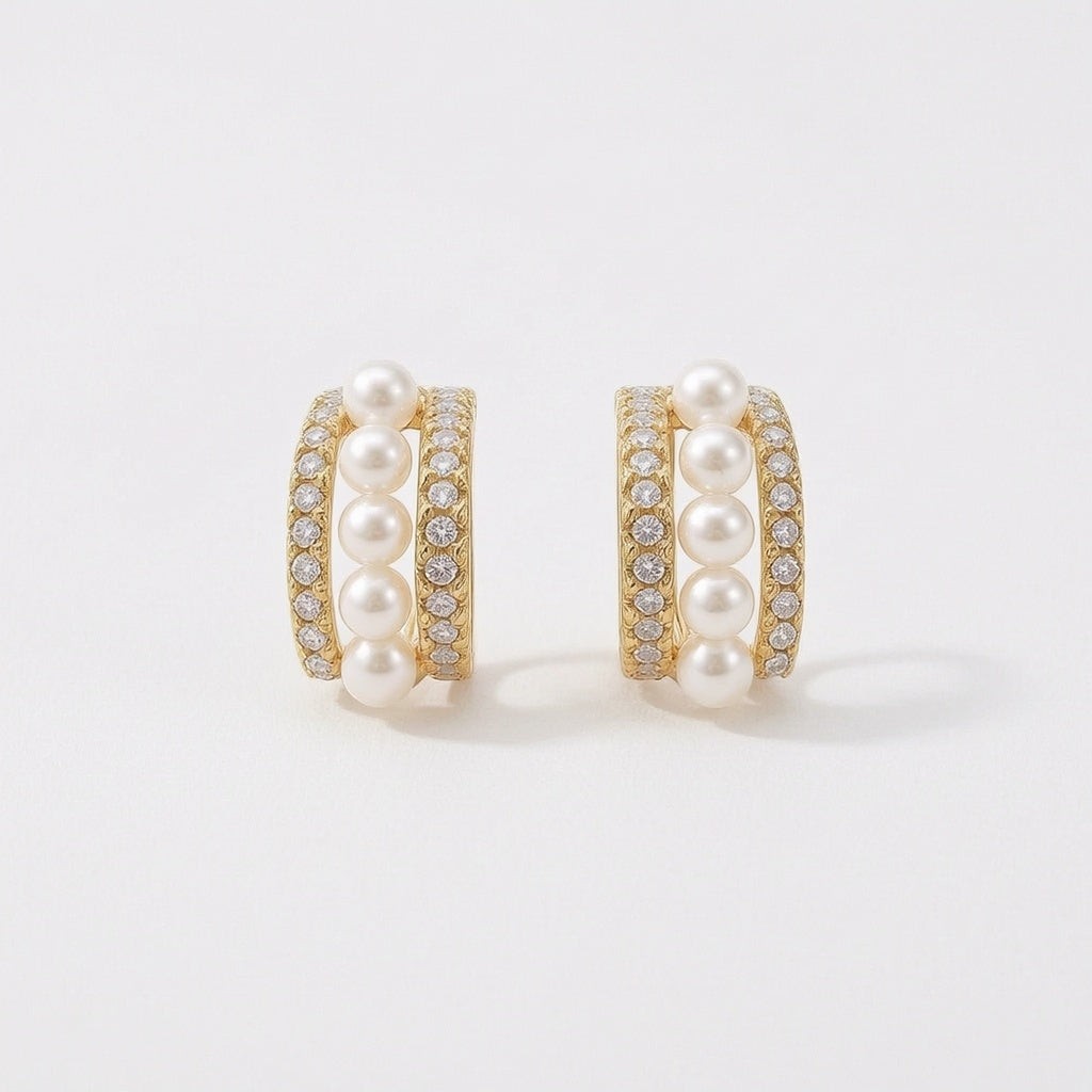 dazzle21 gold hoop earrings featuring a central row of white pearls flanked by sparkling cubic zirconia stones
