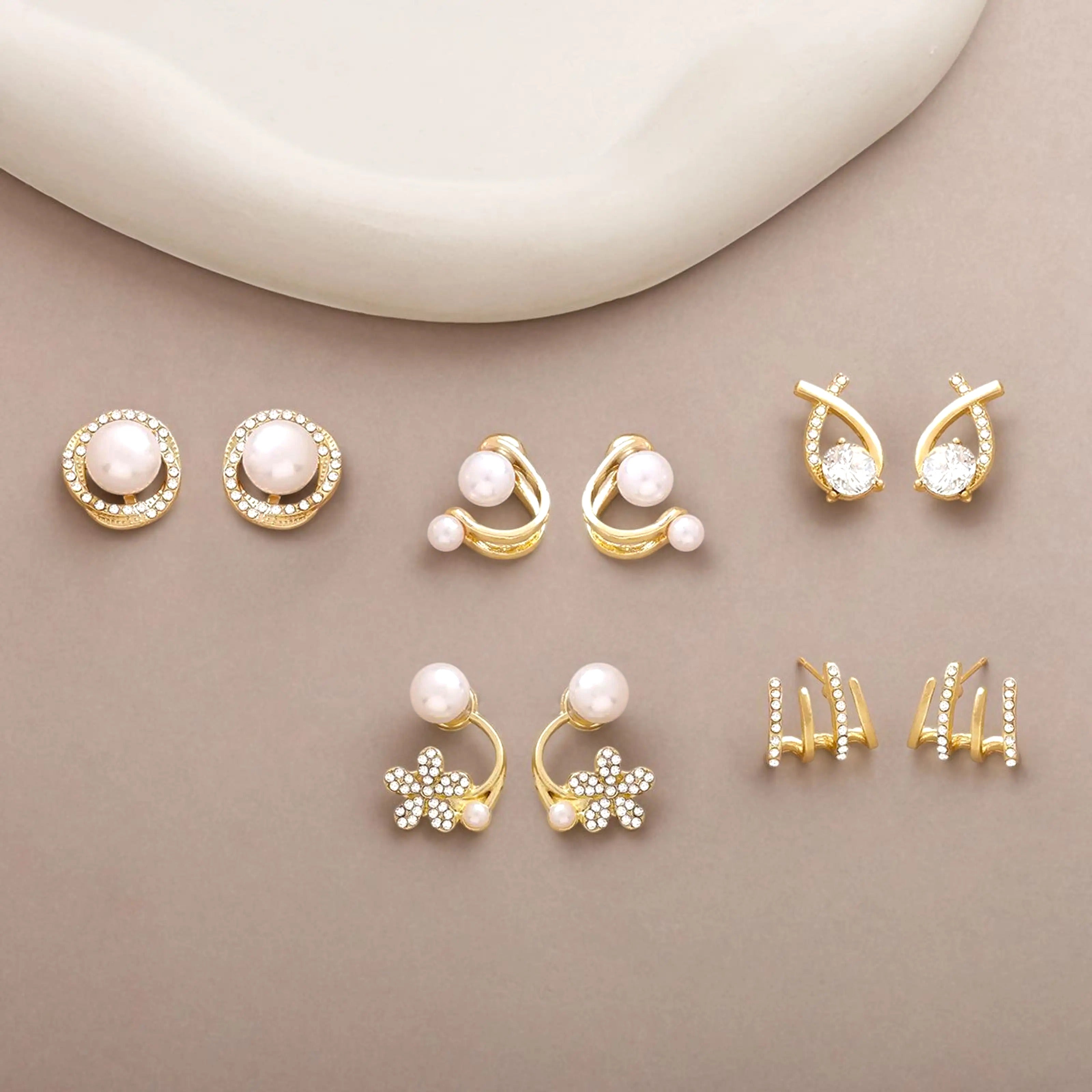 dazzle21 gold-tone alloy stud earring set featuring faux pearls, zirconia crystals, star, and leaf motifs