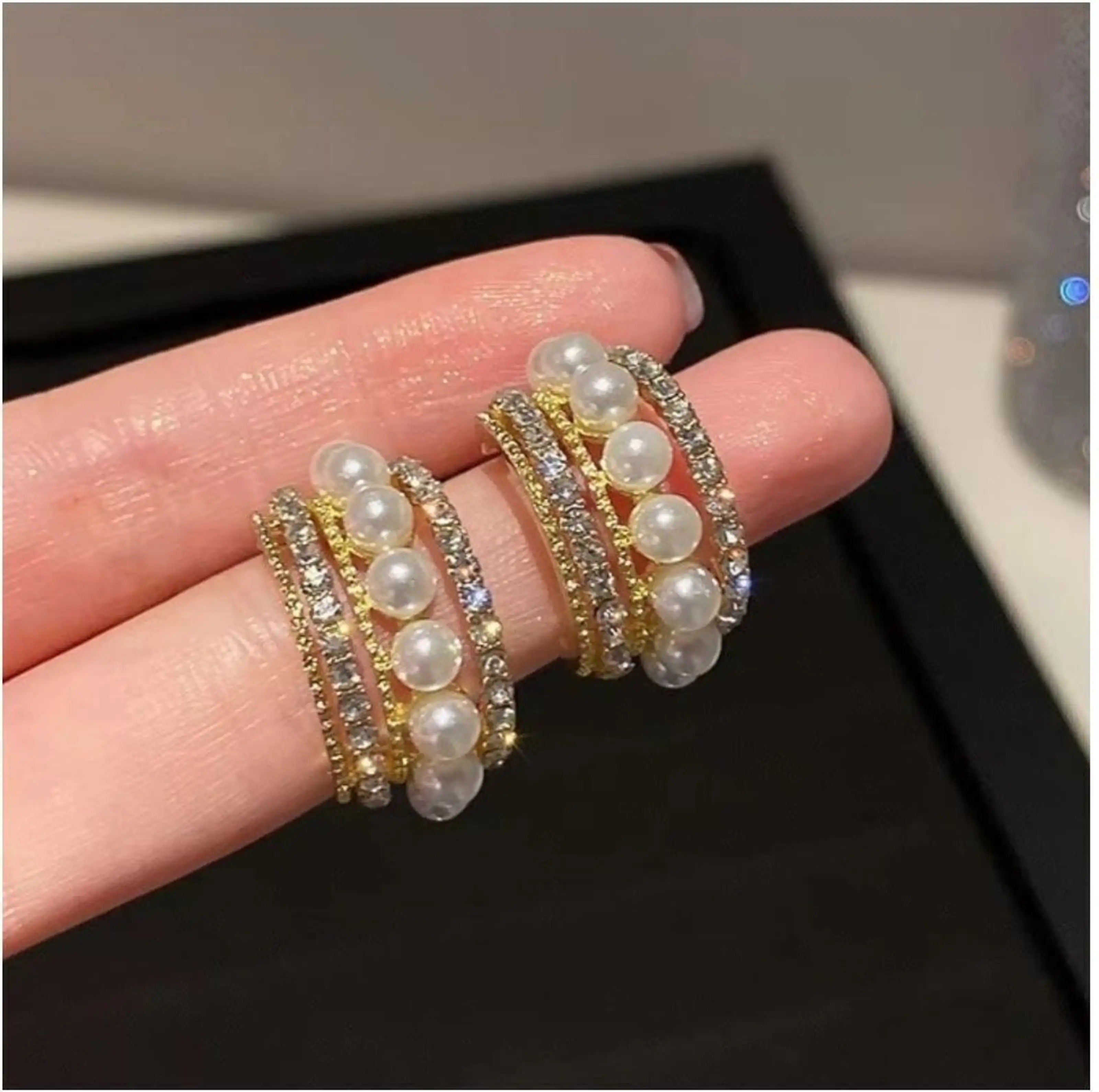 dazzle21 gold-tone layered stud earrings featuring white pearls and sparkling cubic zirconia stones on brass alloy