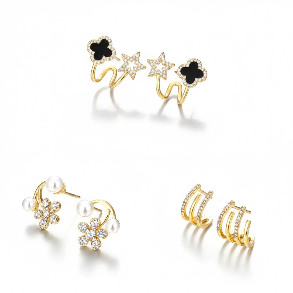 dazzle21 set of 3 gold-tone earrings featuring black clover, star, floral pearl, and rhinestone hoop designs