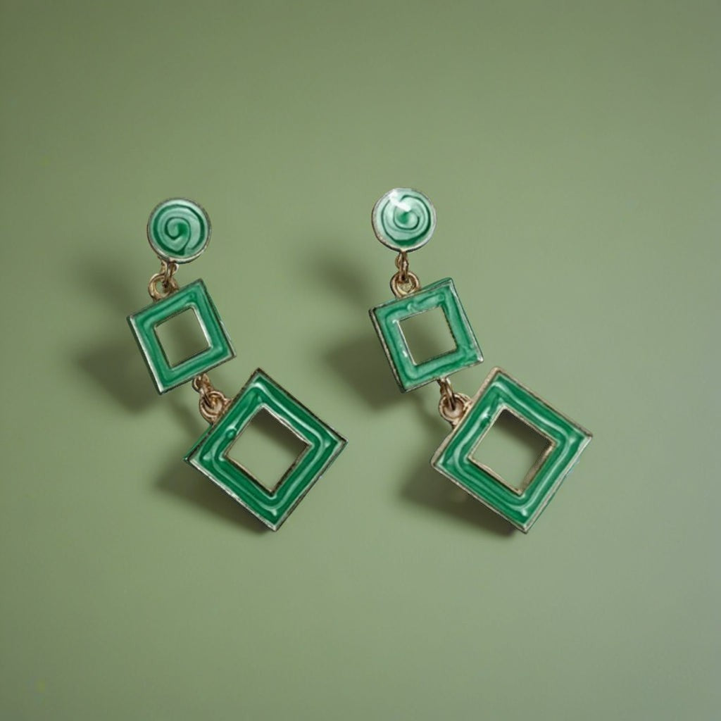 dazzle21 green geometric square drop earrings with a modern double-square design on a matching green background