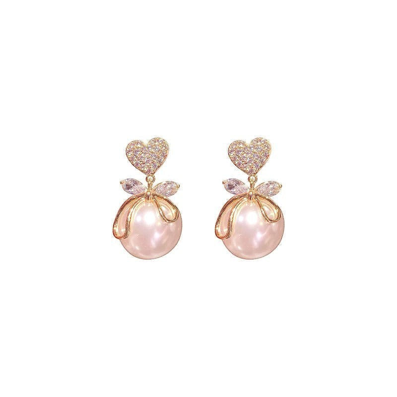 dazzle21 gold heart crystal stud earrings with delicate bow detail and lustrous faux pearl drop