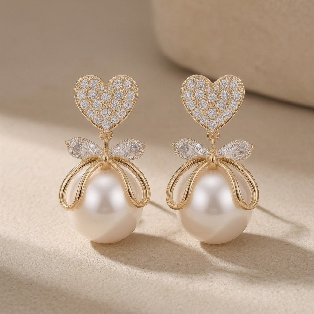 dazzle21 gold-tone heart and pearl drop earrings with crystal-encrusted bow accents in a Korean-inspired style