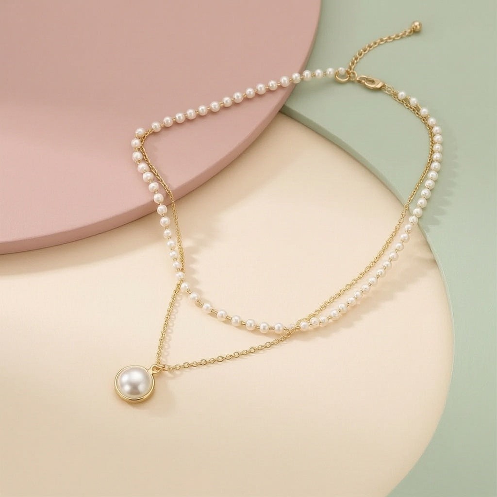 dazzle21 layered gold-tone chain necklace featuring delicate white pearl beads and a single round pearl pendant