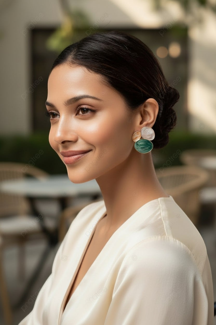 dazzle21 pastel statement earrings with blue, mint, and lavender resin swirls worn by a smiling woman in a white top