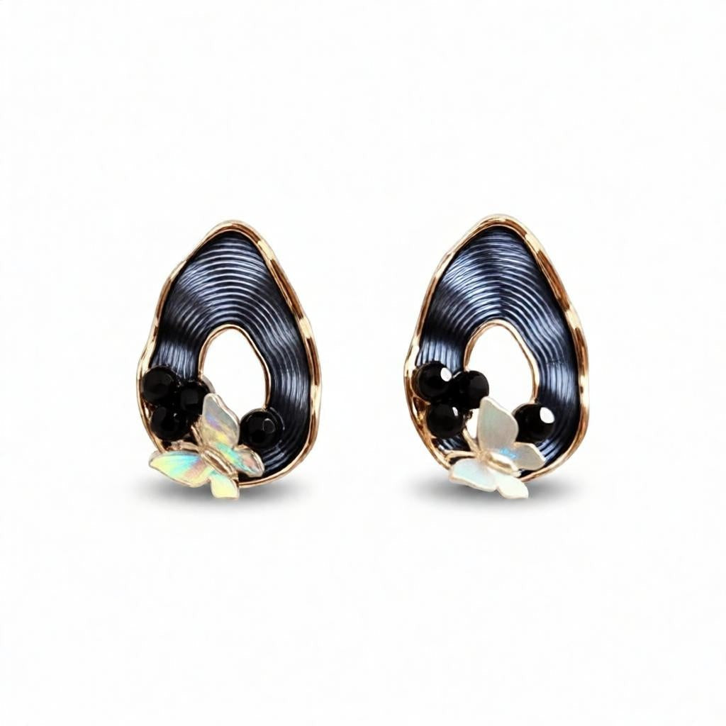 dazzle21 pear-shaped ribbed earrings with black accents, opalescent butterfly charms, and gold-tone frames.