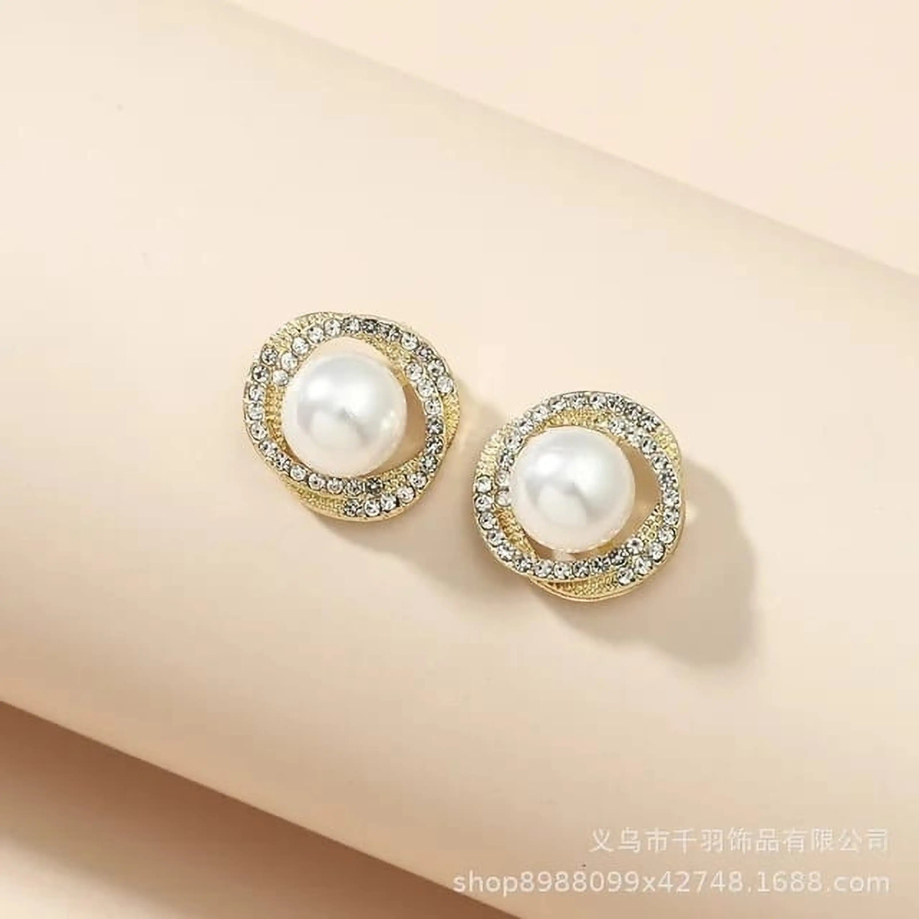 dazzle21 Korean style gold-tone stud earrings featuring a central faux pearl surrounded by sparkling crystal rhinestones