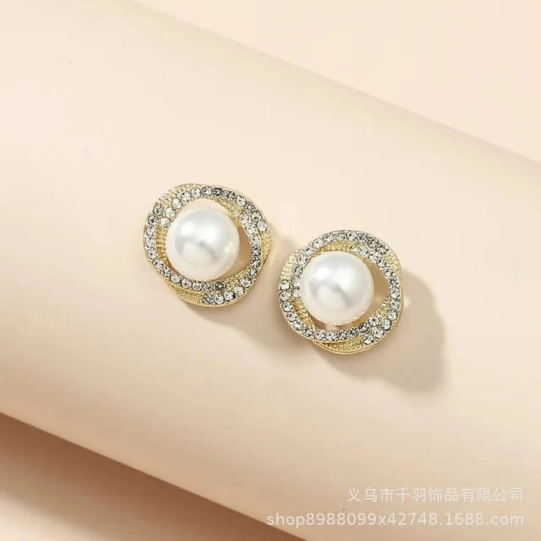 dazzle21 Korean style gold-tone stud earrings featuring a central faux pearl surrounded by sparkling crystal rhinestones