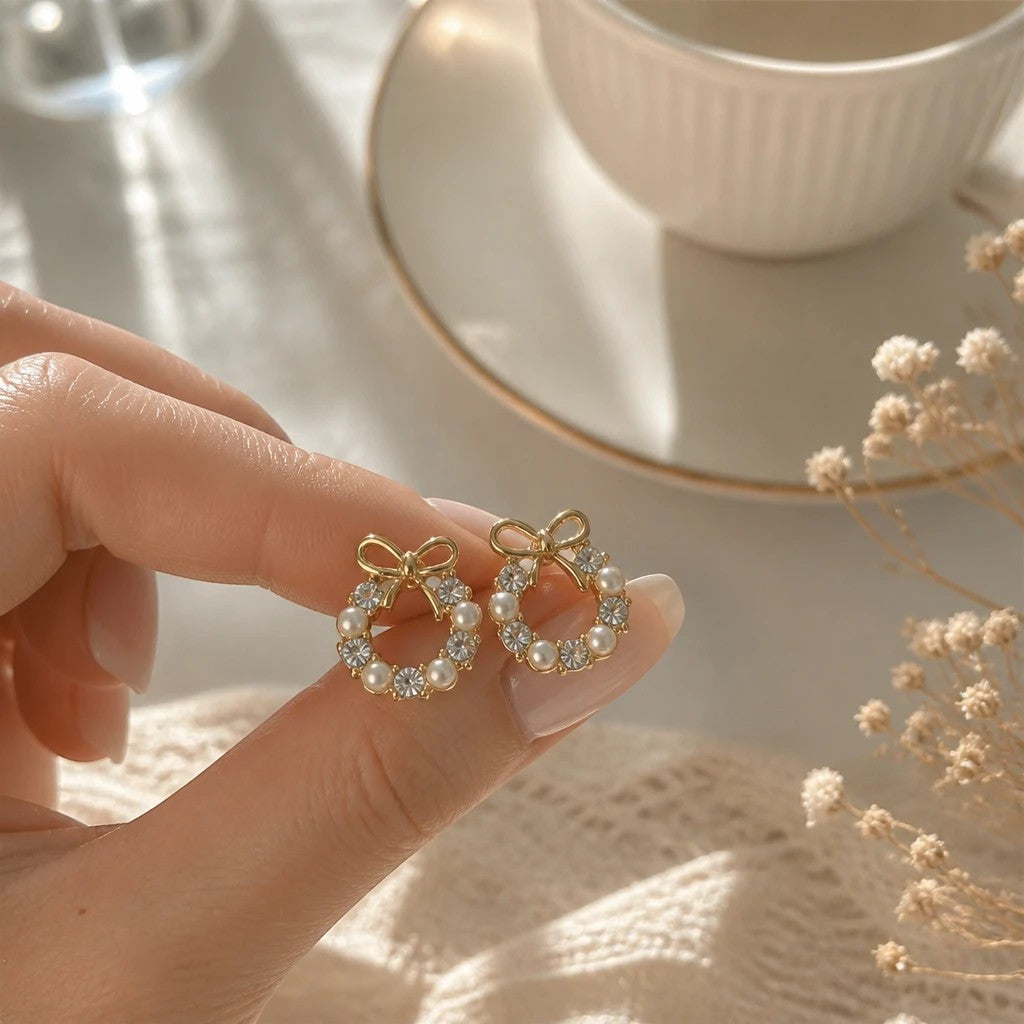 dazzle21 gold-tone alloy wreath stud earrings featuring delicate pearls and crystals with a small bow detail