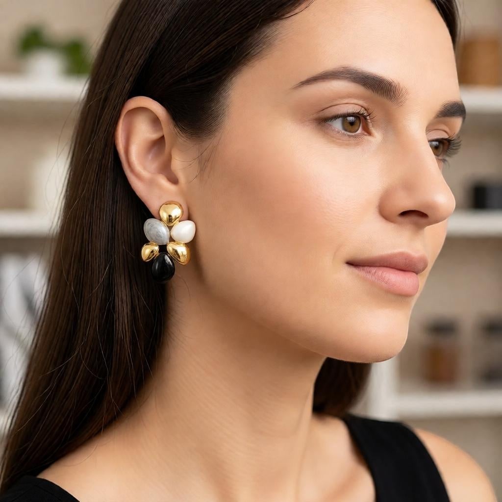 dazzle21 modern pebble cluster stud earrings with gold accents and marbled resin stones worn by a woman