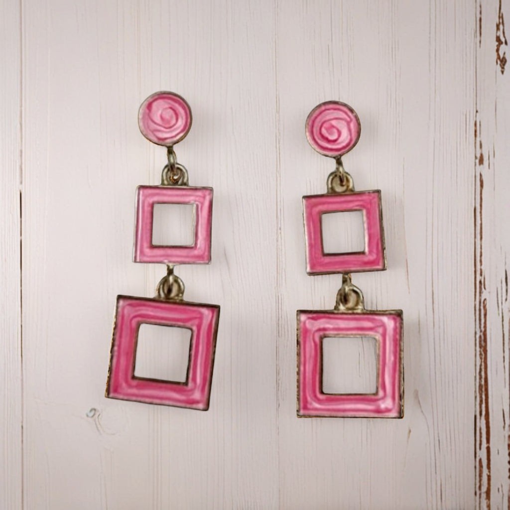 dazzle21 pink geometric square drop earrings with a modern double-square design on a white wooden background