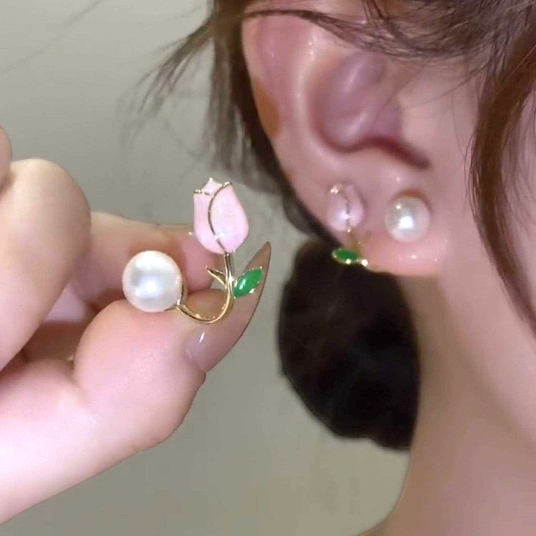 dazzle21 gold-tone tulip ear cuff earrings featuring a pink floral design, green leaf accent, and luminous faux pearl.