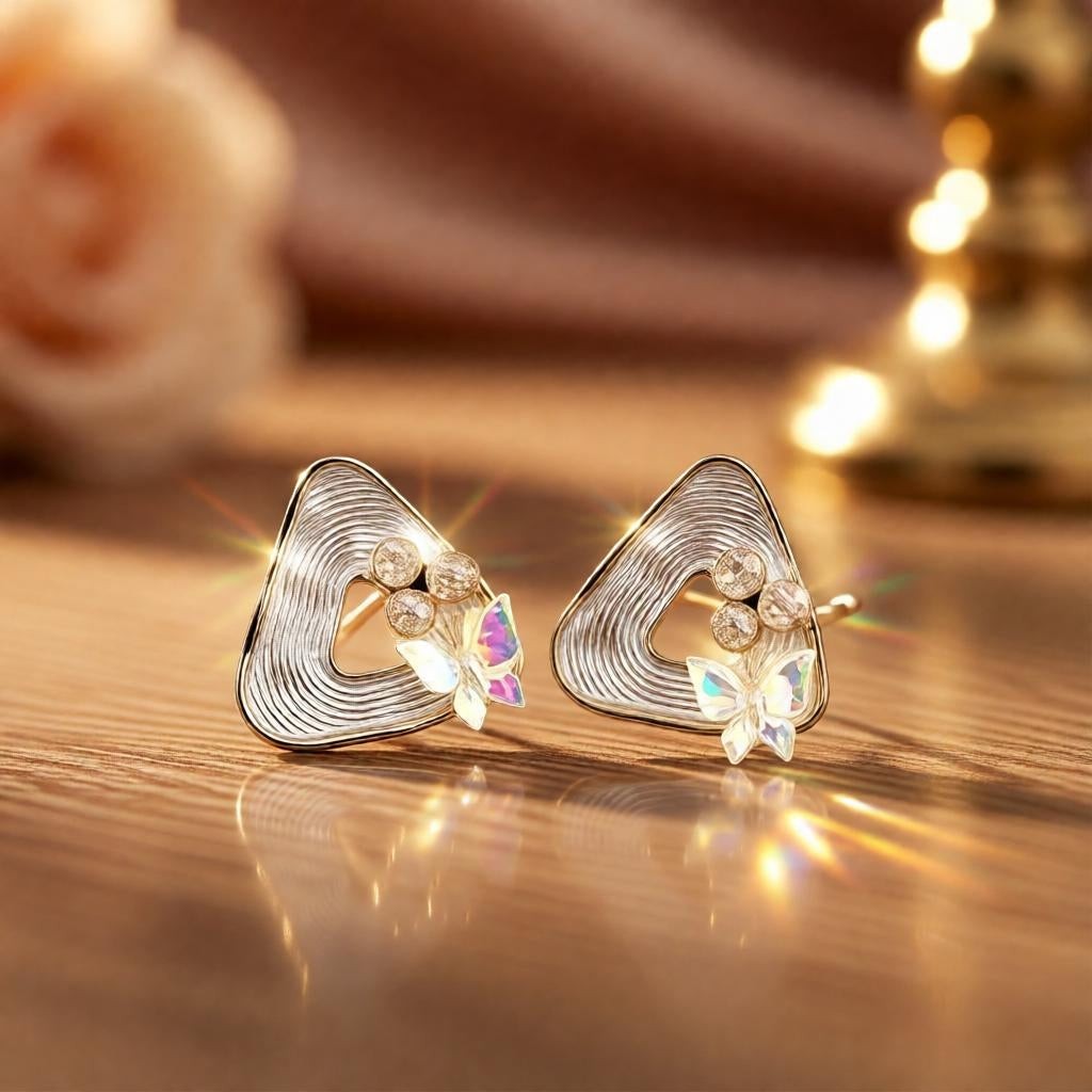 dazzle21 geometric triangle stud earrings with ribbed gold finish, iridescent butterfly accents, and small pearl studs