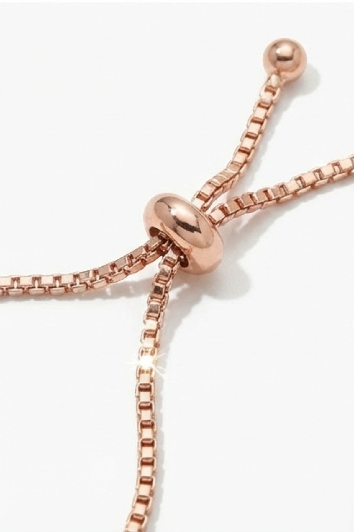 dazzle21 rose gold-tone adjustable bolo clasp on a fine box chain bracelet with polished bead ends