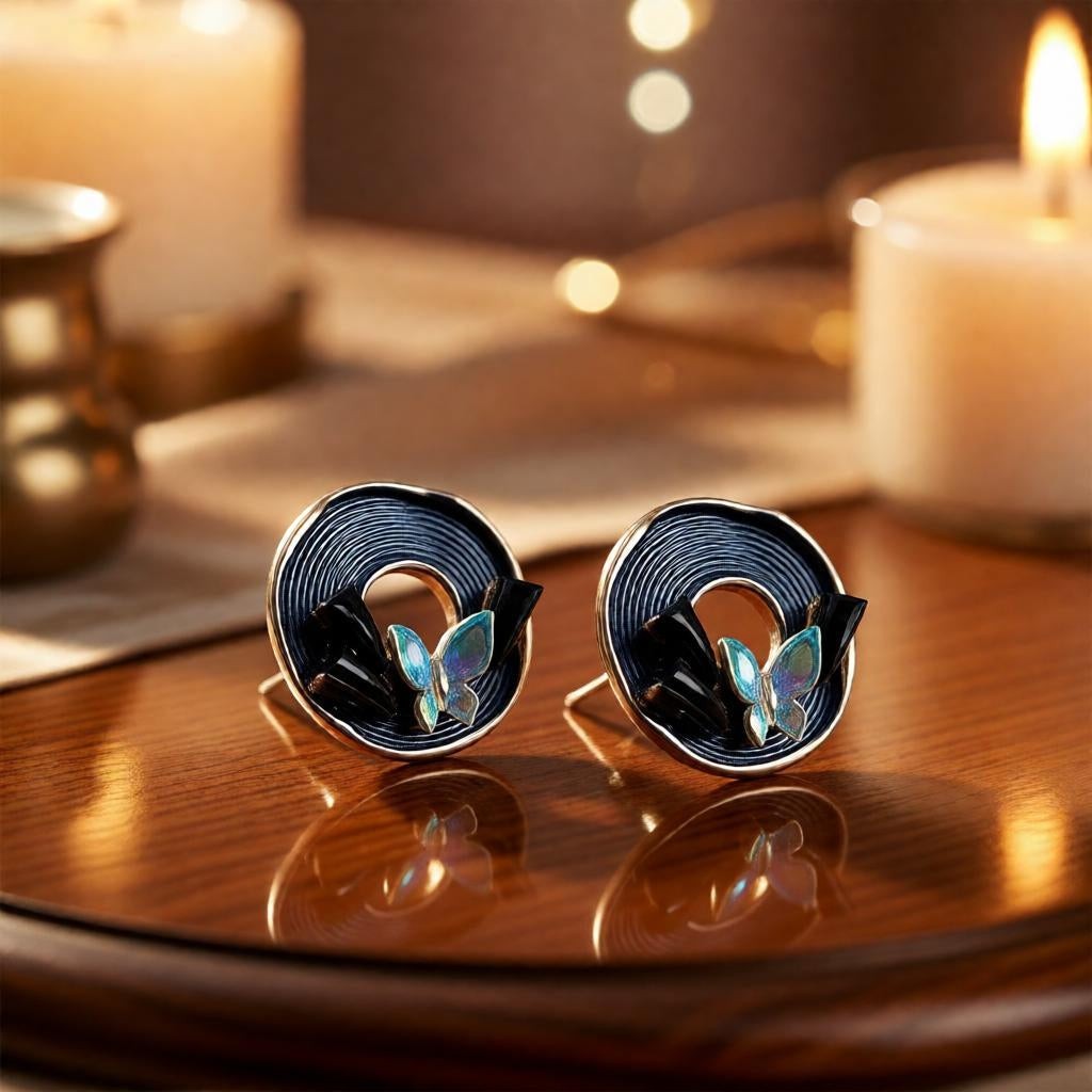 dazzle21 Blossom Glow rose gold stud earrings featuring a circular spiral pattern and delicate pastel butterfly accents.