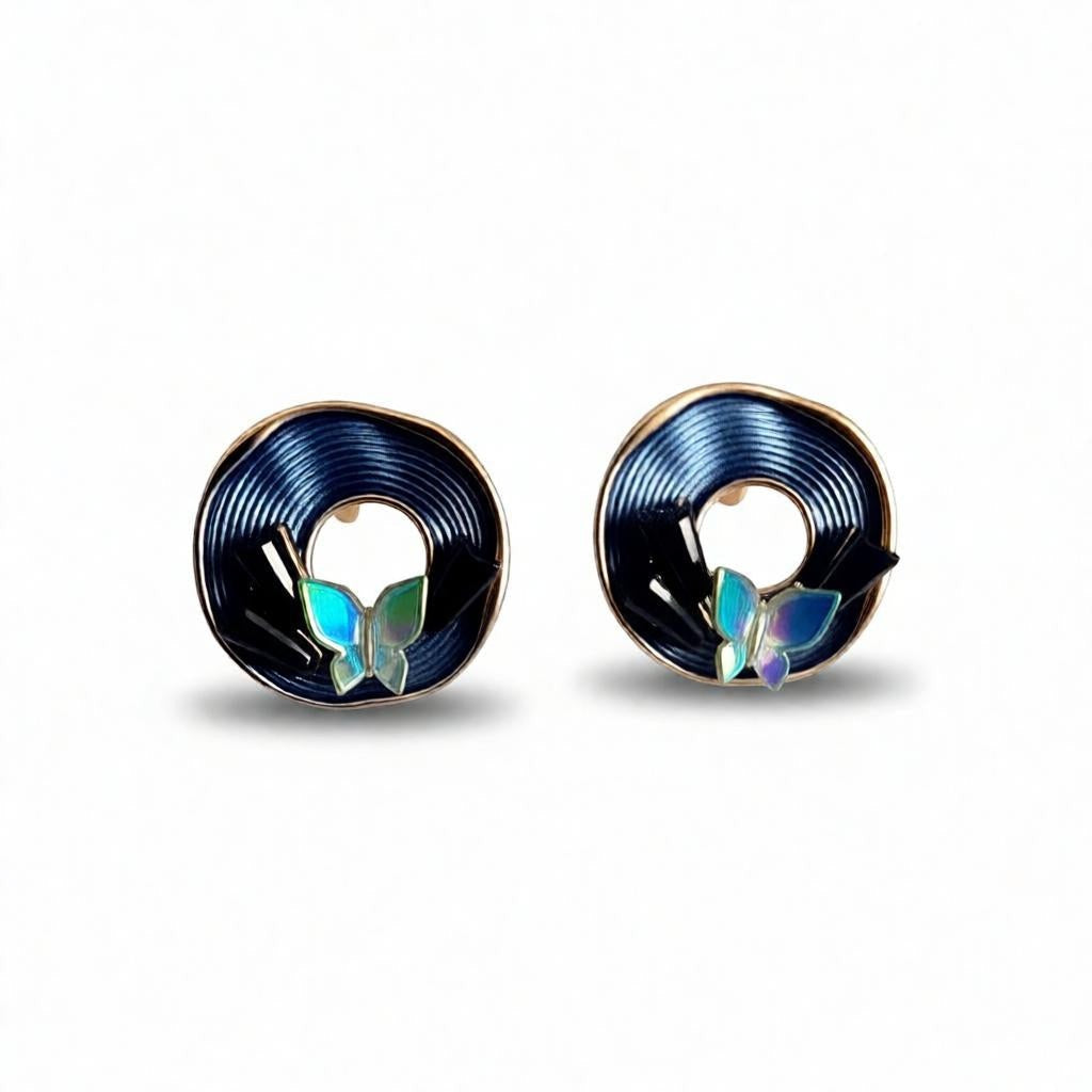 dazzle21 Blossom Glow rose gold stud earrings featuring a circular spiral pattern and iridescent butterfly accents.