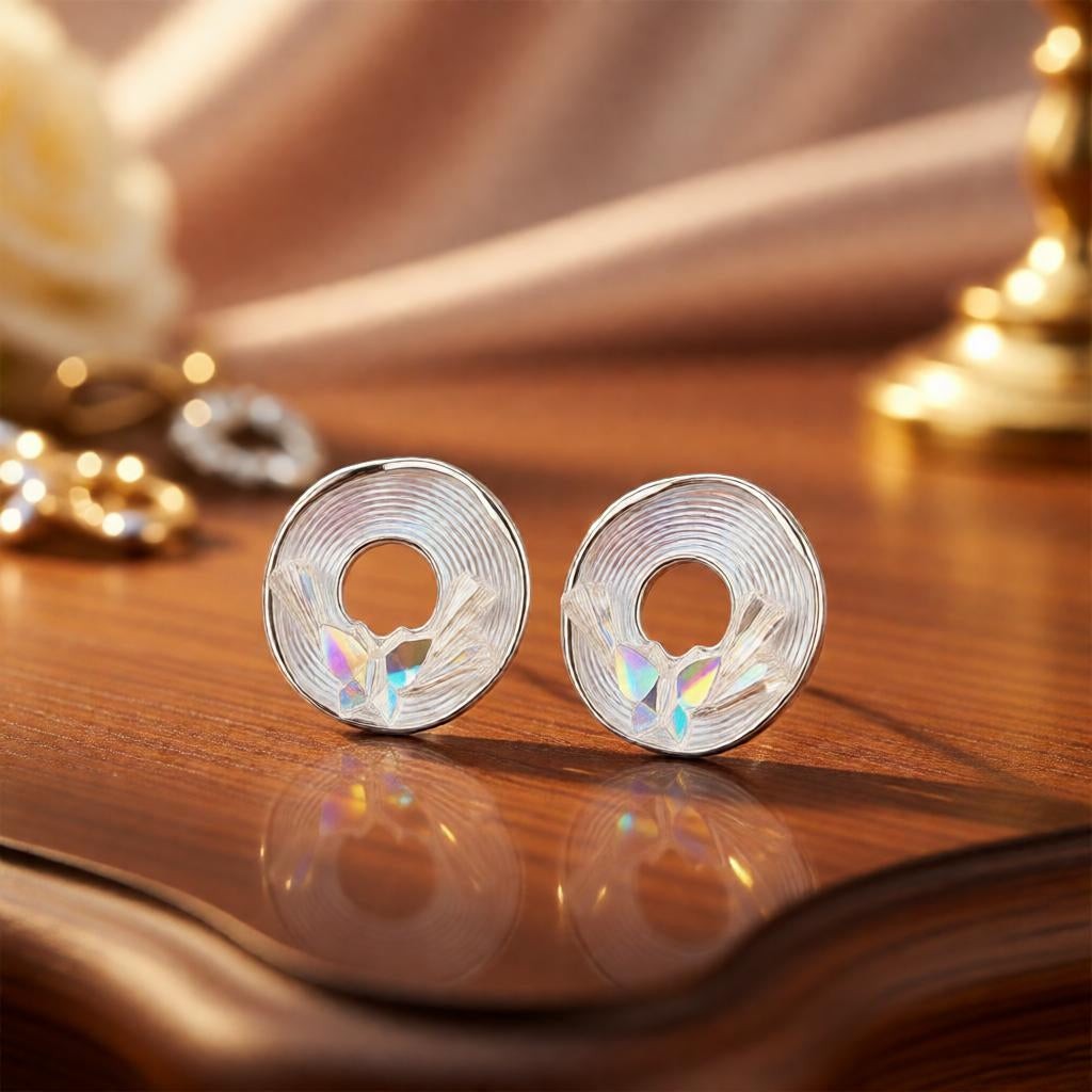 dazzle21 Blossom Glow rose gold stud earrings featuring a circular spiral design with iridescent butterfly accents.