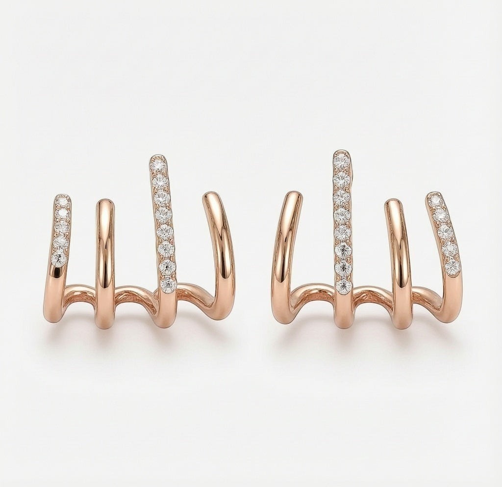 dazzle21 rose gold alloy claw stud earrings with sparkling crystal accents in a unique multi-pronged design