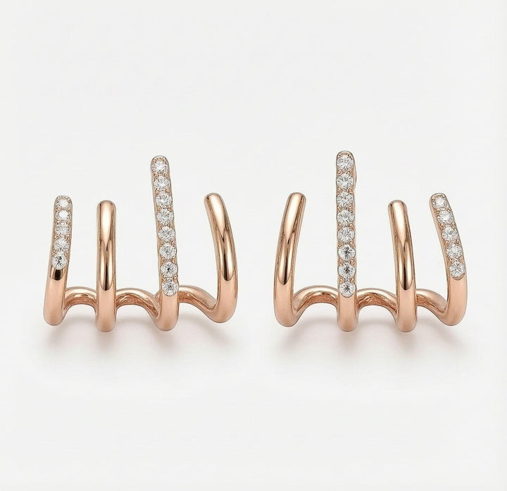 dazzle21 rose gold alloy claw stud earrings with sparkling crystal accents in a unique multi-pronged design