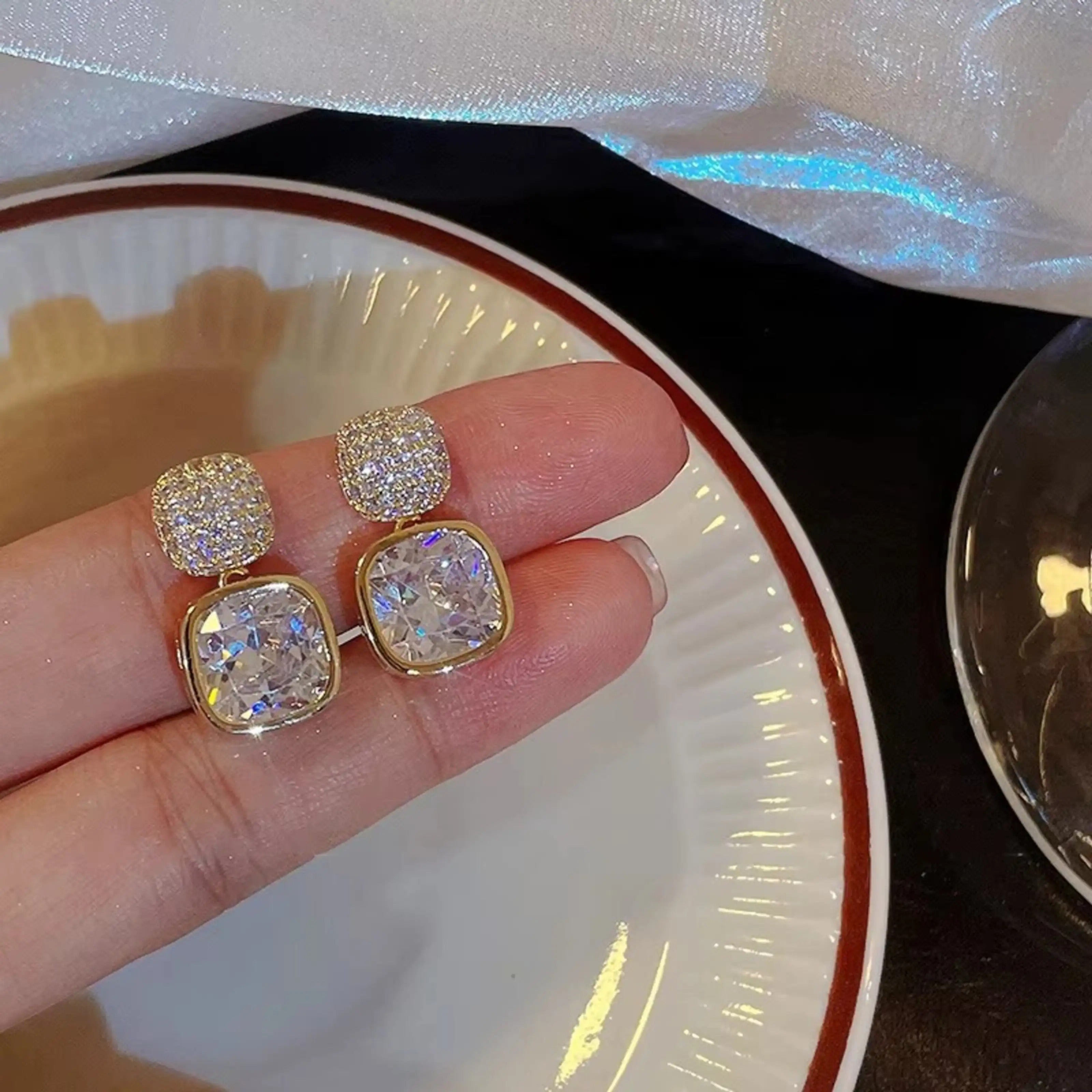 dazzle21 gold-tone square drop earrings featuring sparkling cubic zirconia studs and large clear crystal stones